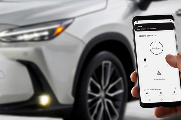 Shot of a smartphone showing the Lexus App with the 2022 Lexus NX in the background