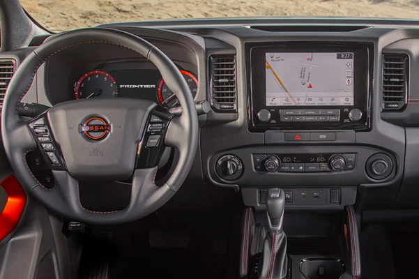 interior wheel and dash view of the 2022 nissan frontier