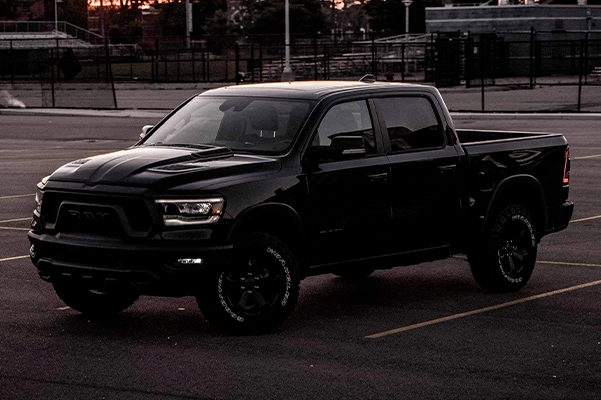 3/4 side view of the black 2022 Ram 1500 parked in a parking lot