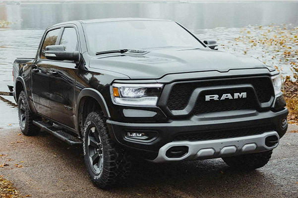 frontal view of the 2022 Ram 1500 towing a boat out of the water