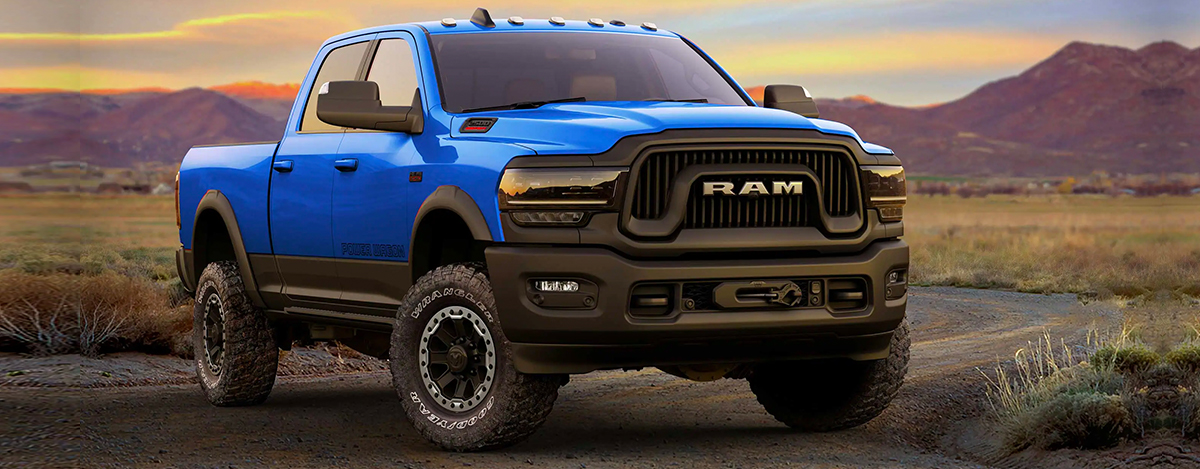 The 2022 Ram 2500 parked on a road with mountains in the distance behind it.