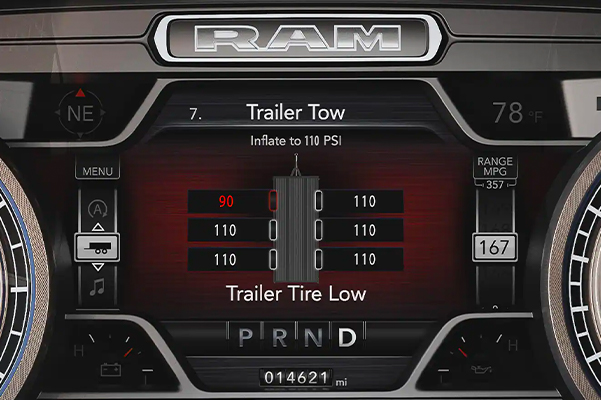 The cluster display in the 2022 Ram 2500 showing the trailer tire pressure with one tire marked in red to indicate low pressure.