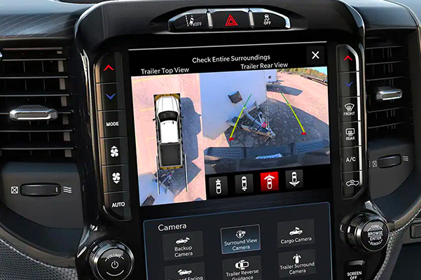 360° Surround View Camera - The touchscreen in the 2022 Ram 2500 displaying the top view and rear view of the truck and trailer.