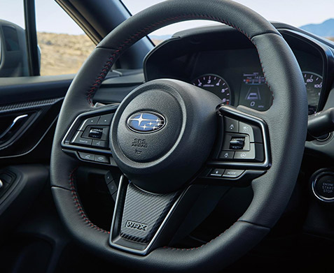 A close up of the D-shaped steering wheel in the 2022 Subaru WRX. 