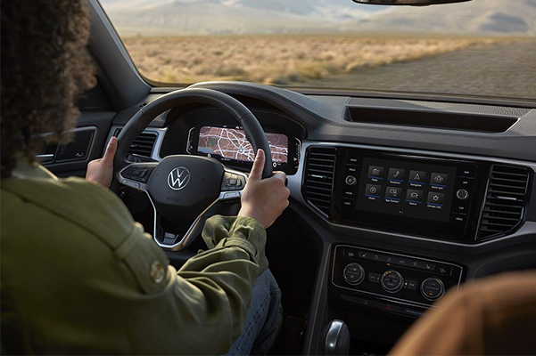 Interior shot of a woman driving the Atlas Cross Sport.