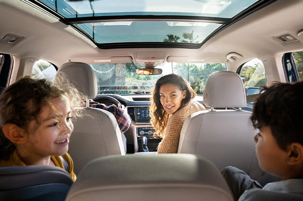 Interior shot of an entire family inside the Atlas, showcasing its vast seating space.