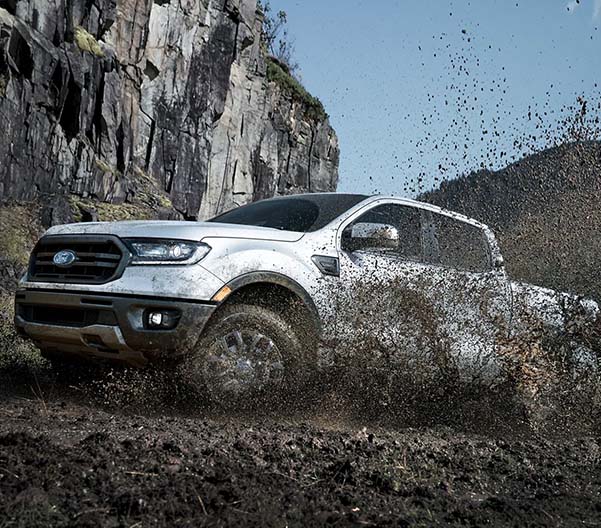 2023 Ford Ranger driving through the mud