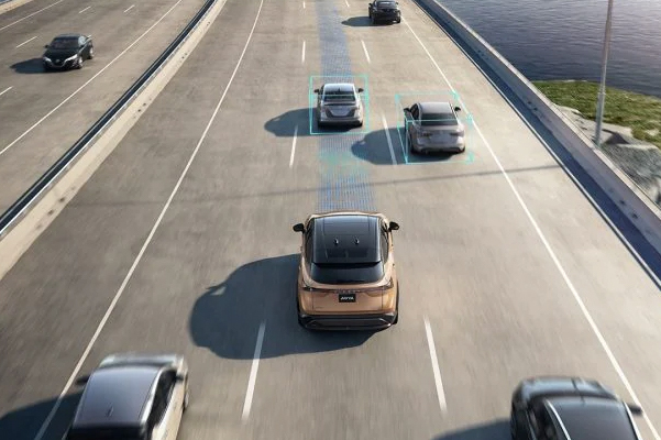 Nissan ARIYA overhead on a highway showing the ProPILOT Assist 2.0 in action