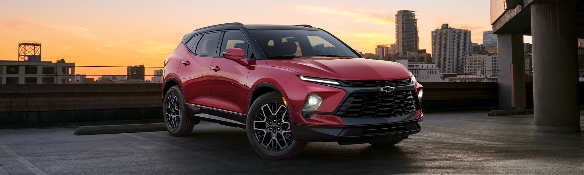 2024 Chevrolet Blazer parked in a parking spot with a city skyline in the background