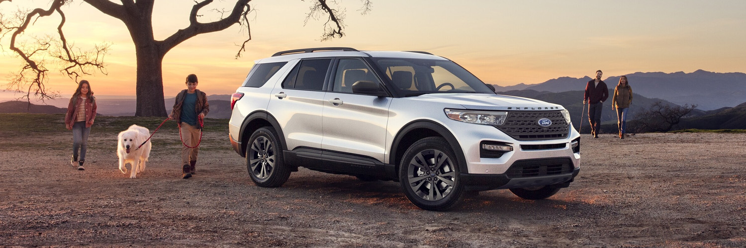 2024 Ford Explorer parked outside with peopel walking by