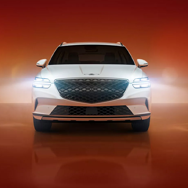 Front view of a 2024 Genesis Electrified GV70 in a studio setting