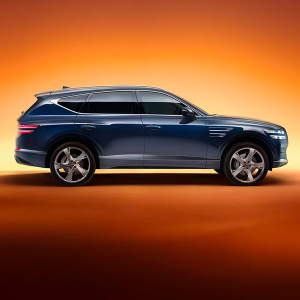 Side profile shot of the 2024 Genesis GV80 in a studio setting