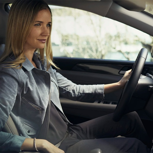 Stylish woman driving her Hyundai