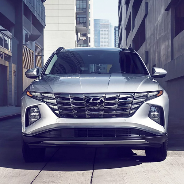 Front grille view of the 2024 Hyundai Tucson in the city