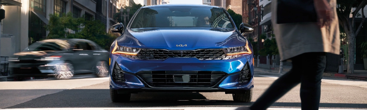 2024 Kia K5 Stopped At A Crosswalk In A City Front View