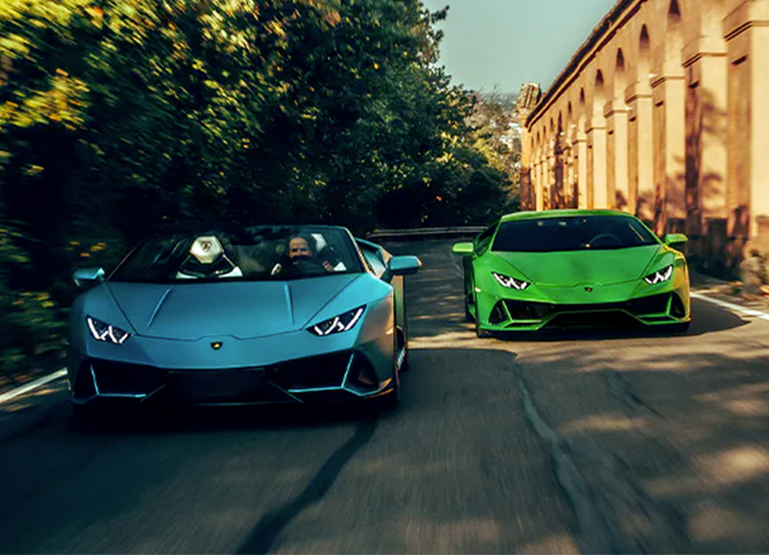 Two Lamborghini Huracán EVO Spyder's driving down the road
