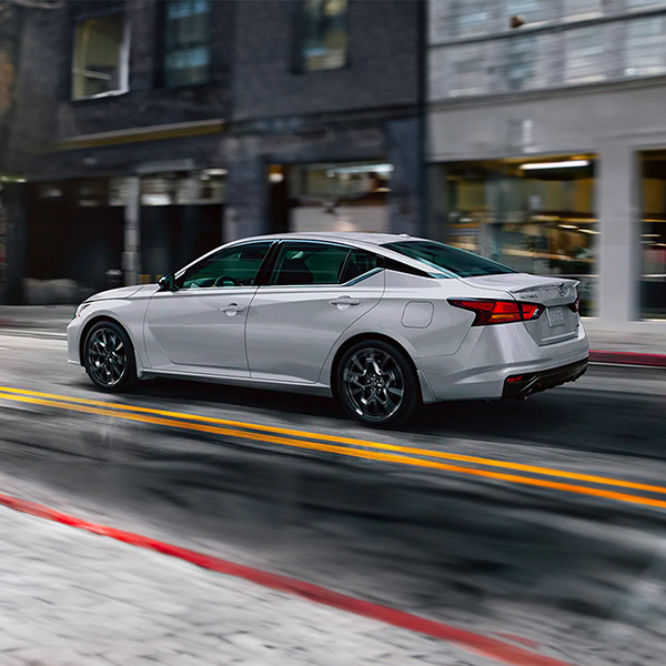 2025 Nissan Altima in motion driving through the city