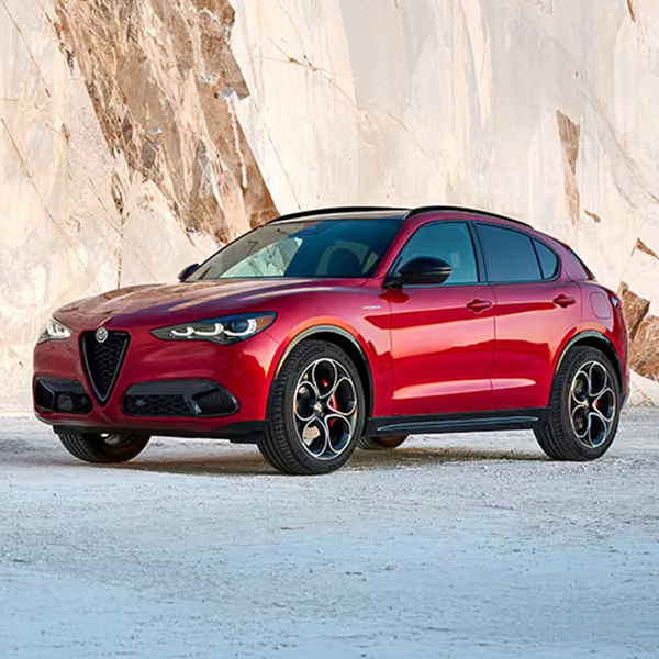 3/4 profile view of a A red 2025 Alfa Romeo Stelvio parked