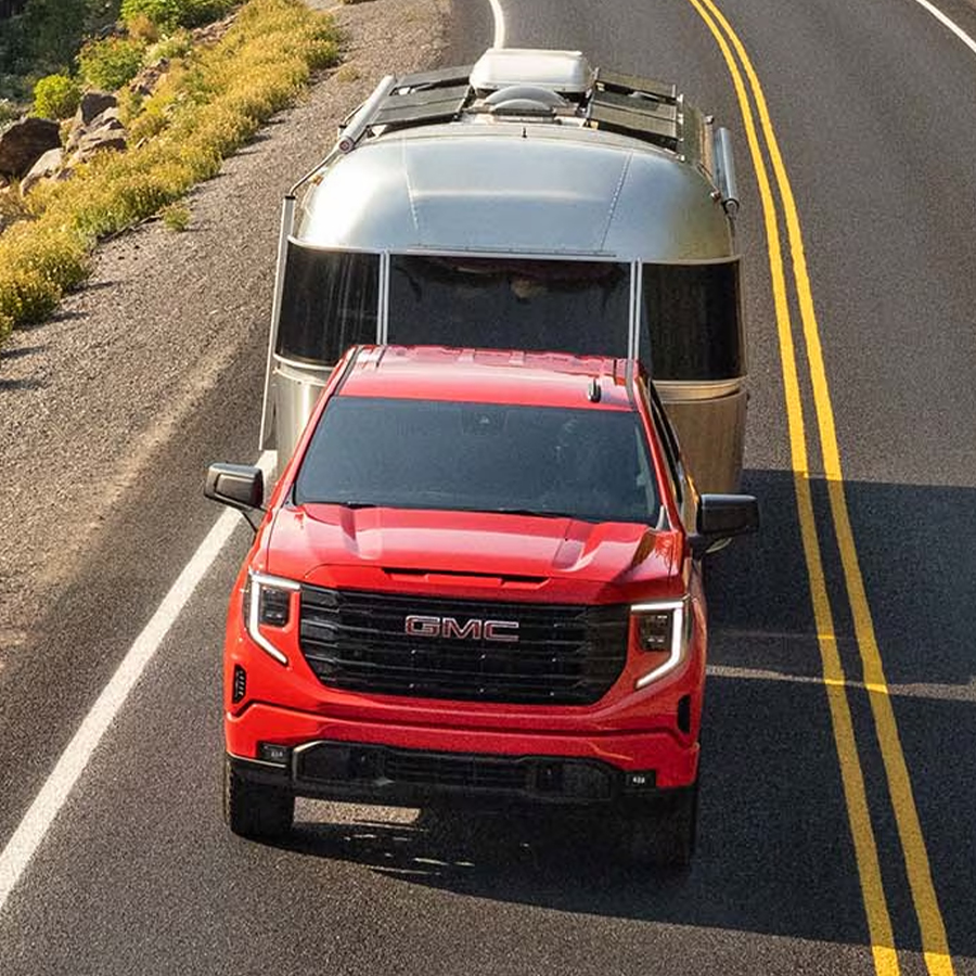 Front view of the 2025 GMC Sierra 1500 driving down the road