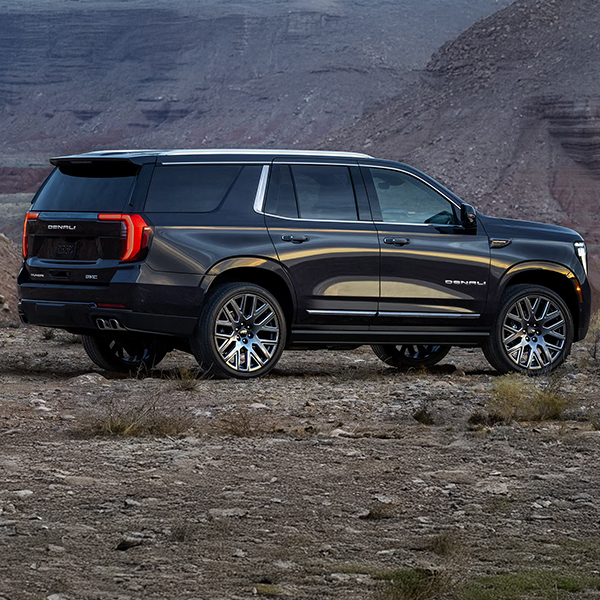 Rear Three-Quarter View of the 2025 GMC Yukon Large SUV Parked in the Desert