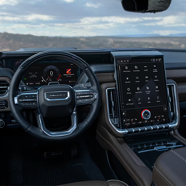 Drivers Side View of the Steering Wheel, Infotainment System and Dashboard in the GMC Yukon