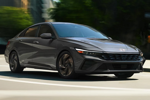 2025 Elantra Hybrid front 3/4 view - driving.