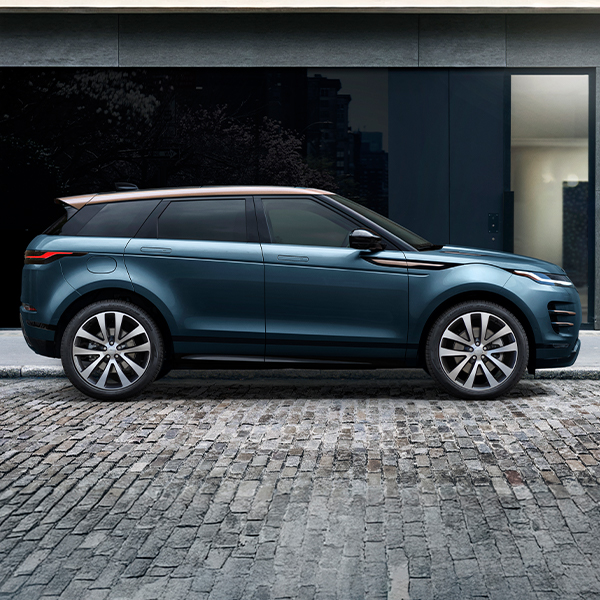 Side profile view of the 2025 Range Rover Evoque parked on a brick street