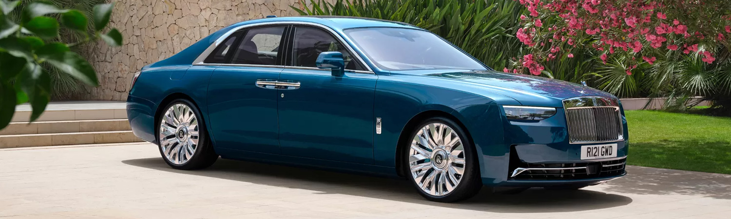 3/4 Side view of the 2025 Rolls-Royce Ghost Series II parked outside