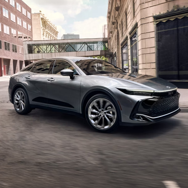 3/4 Side view of the 2025 Toyota Crown driving through the city