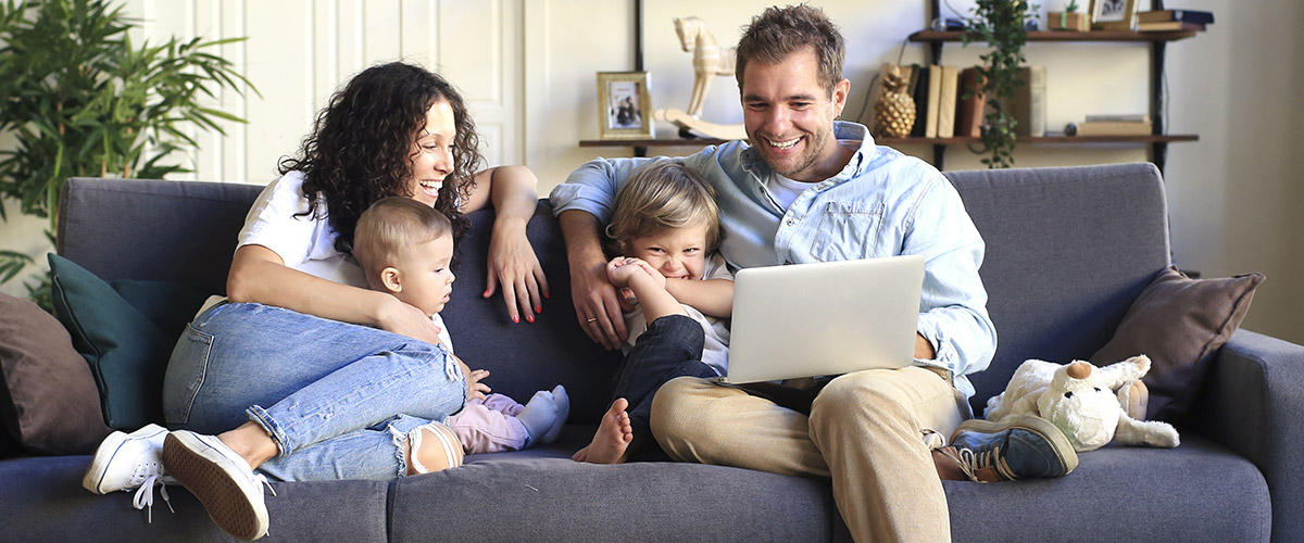 Shopping online with family on couch