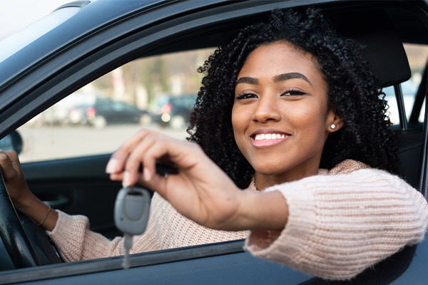 woman in car with keys