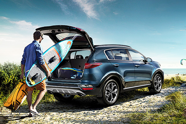 2020 Kia Sportage on beach shown in blue