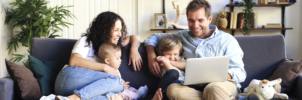 Young beautiful happy family relaxing at home