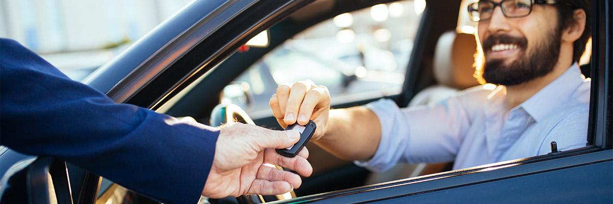 man recieving car keys 