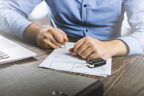 Customer filling out paper work