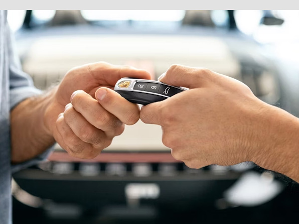 Porsche keys being handed to a customer
