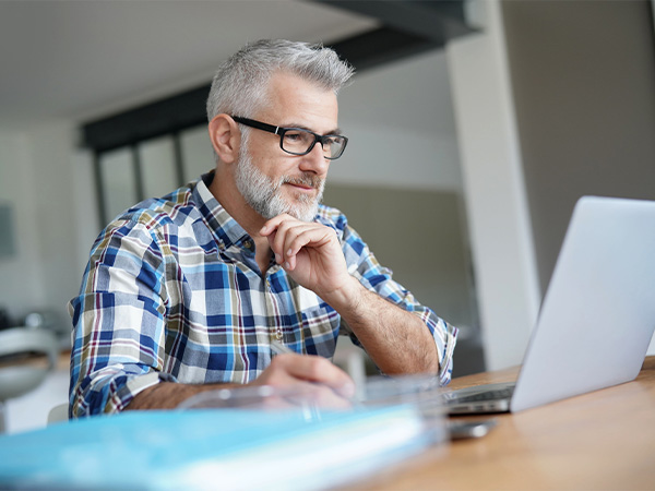 Man checking his buying power on the computer