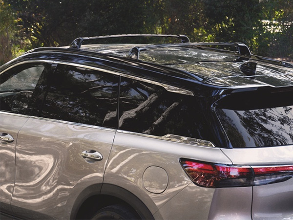 INFINITI vehicle with a roof rack outside on a sunny day
