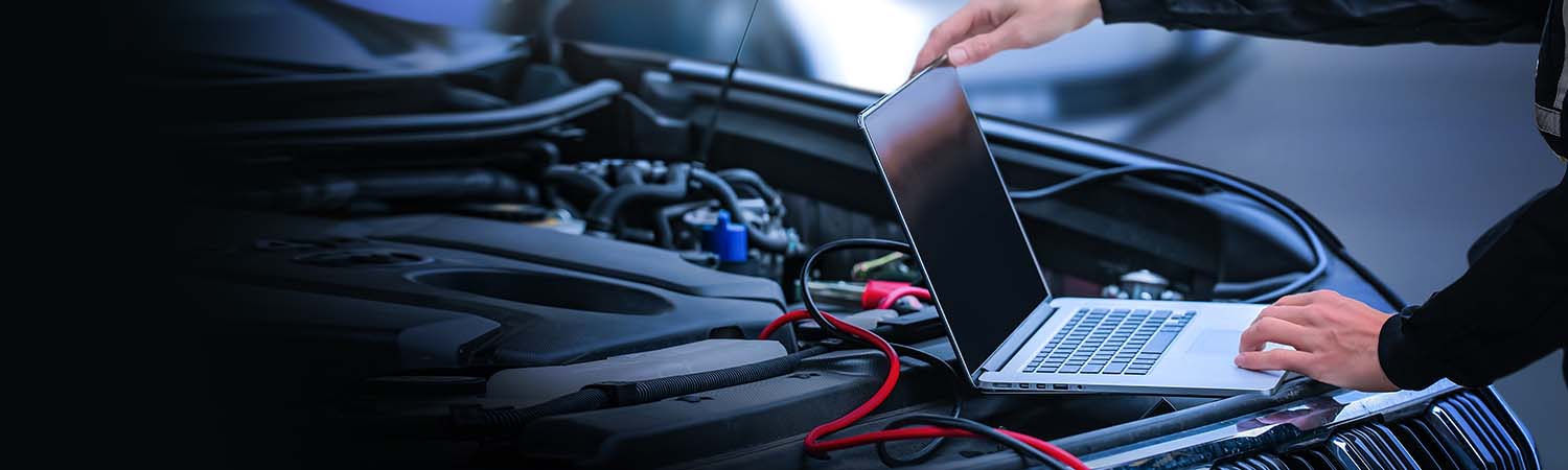 Service tech checking a vehicle