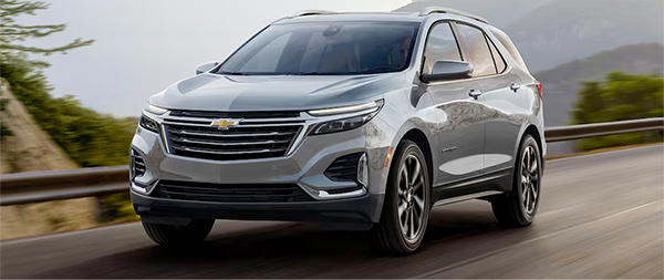 2024 Chevrolet Equinox driving down the road