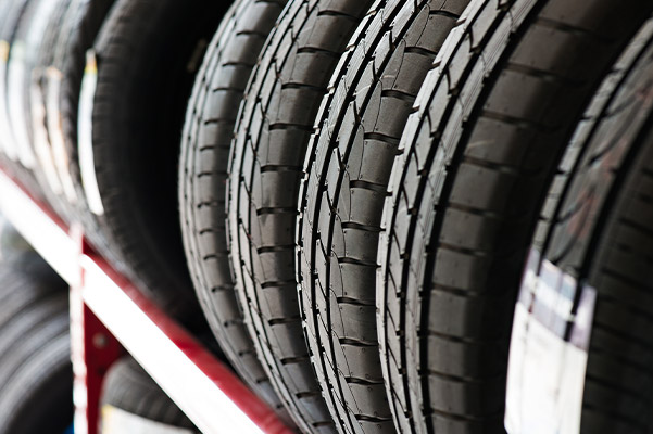 multiple car tires on a storage rack