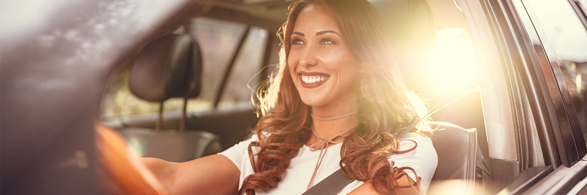 woman happily driving