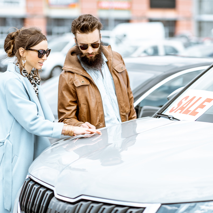 Happy couple shopping for a used vehicle