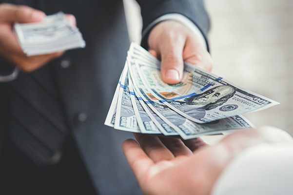 Salesman handing cash to customer