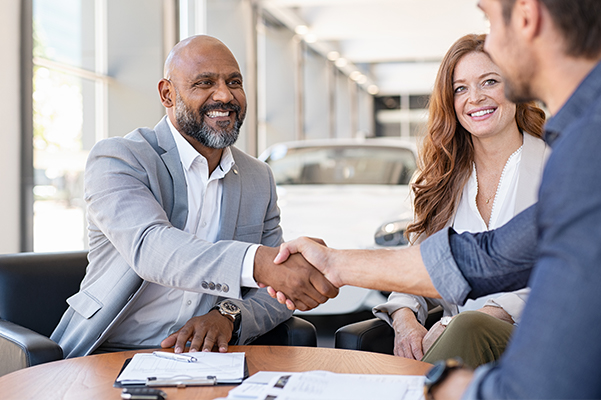 Customer Shaking Hands with Dealership Employee